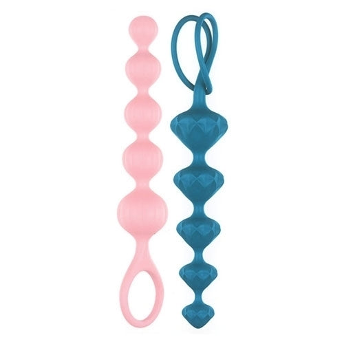 Two strings of silicone beads, one pink and one teal, with a loop on the pink one and a string on the teal one.