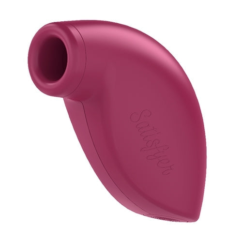 A pink Satisfyer clitoral vibrator with a curved design and textured surface.