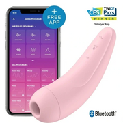 A pink, curved vibrator with a phone displaying app programs.
