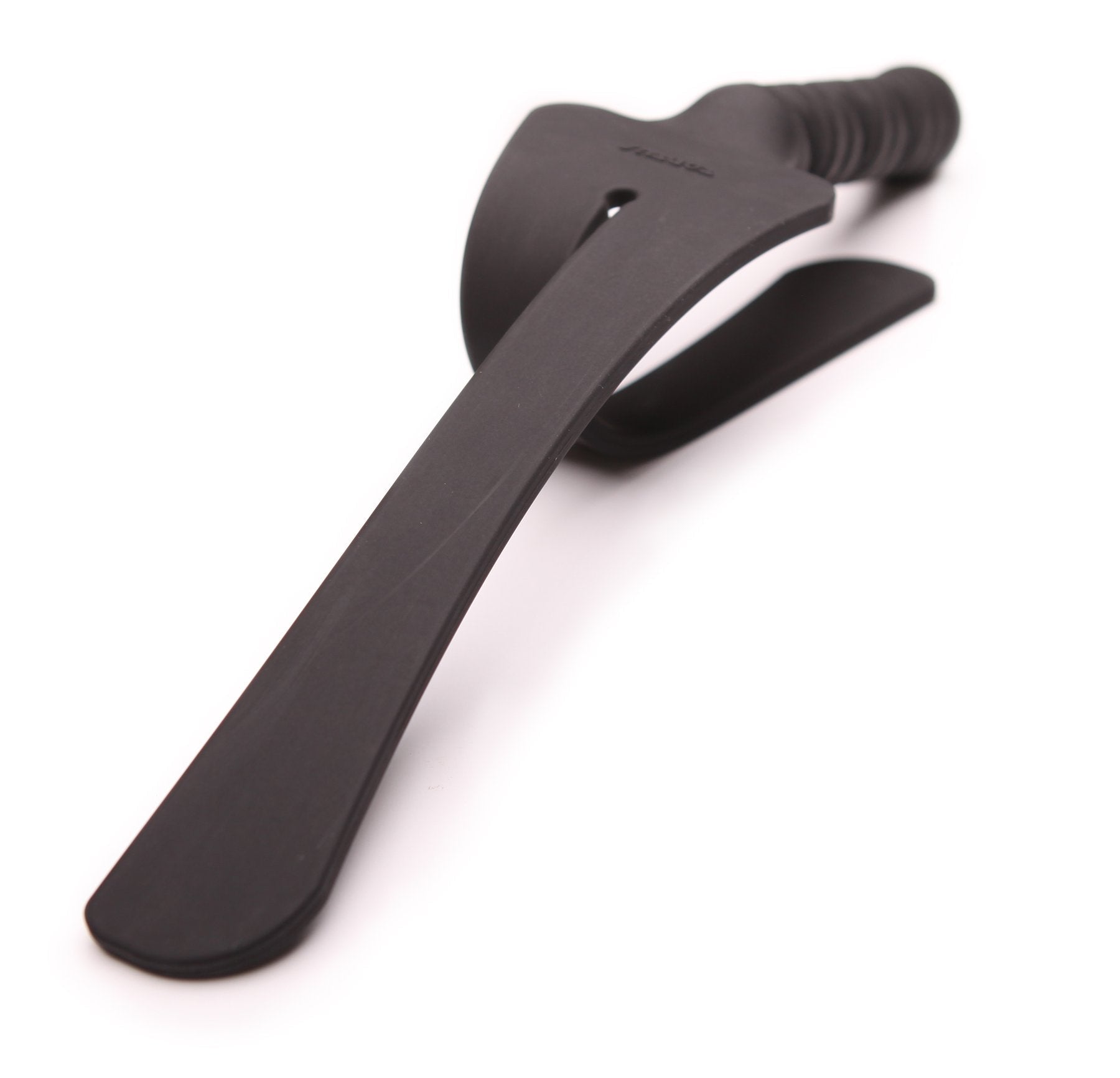 Black silicone spanking paddle with a ribbed handle.