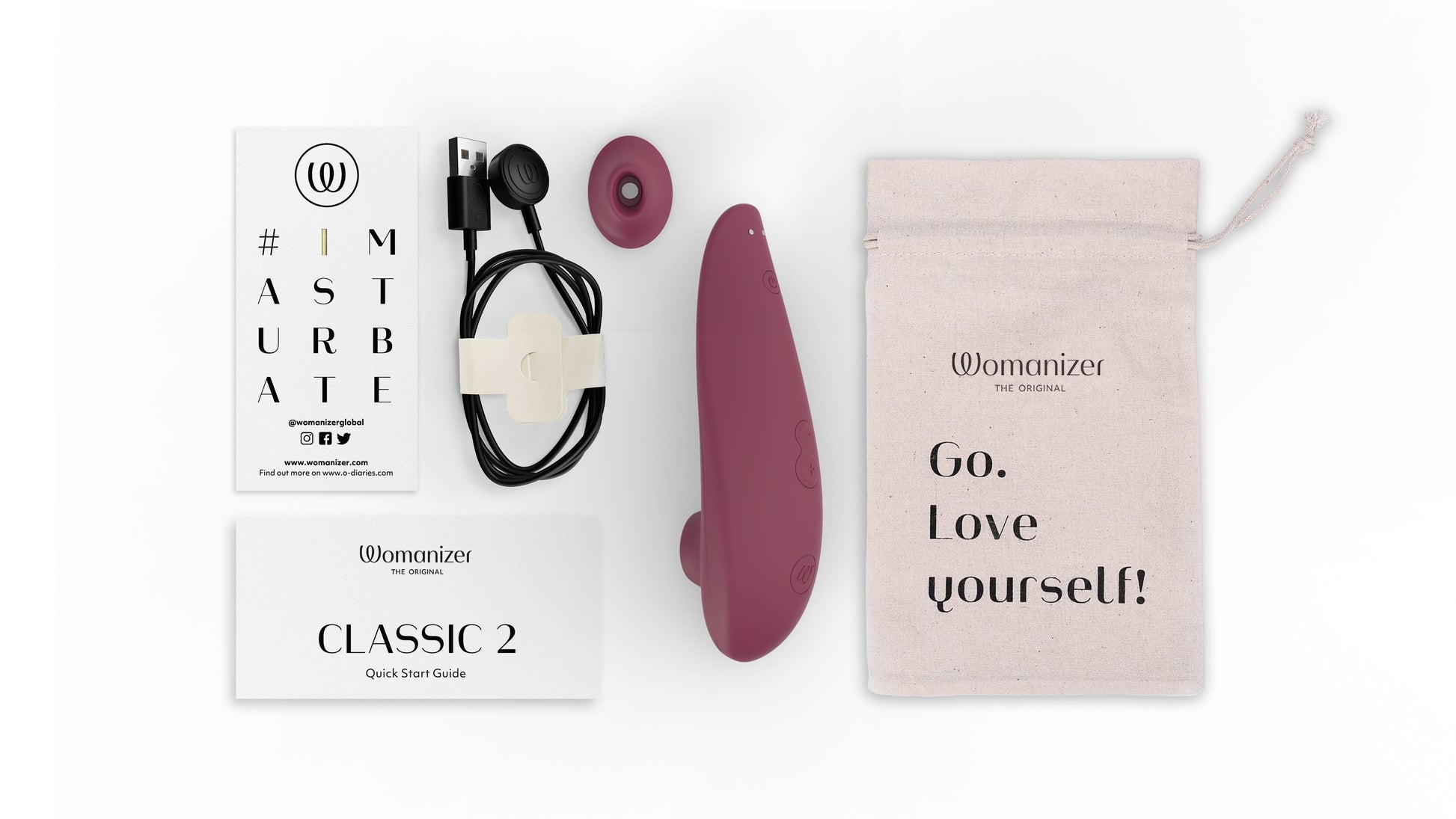 Womanizer Classic 2 clitoral stimulator in bordeaux with accessories and storage bag.