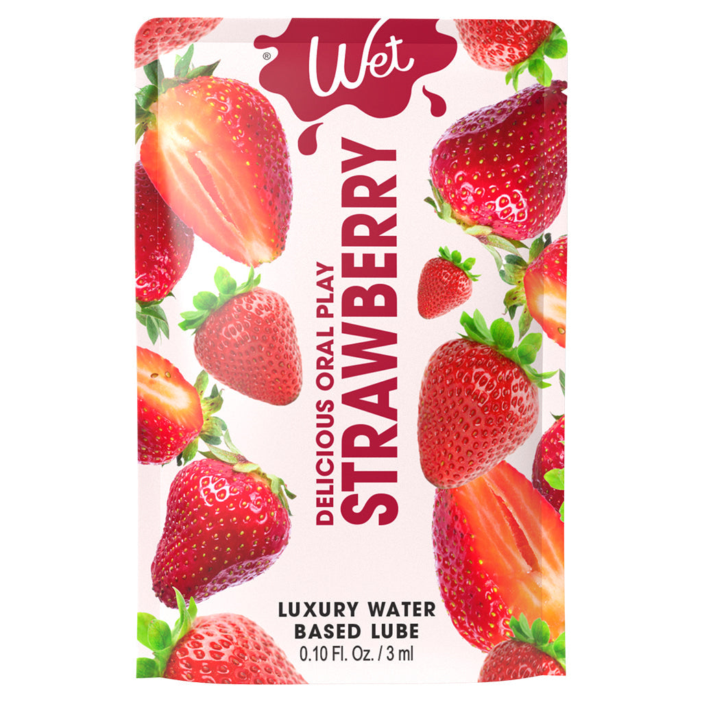 Wet Strawberry flavored personal lubricant packet with strawberries.