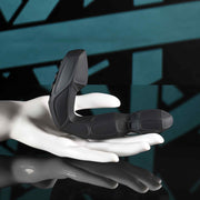 Black remote-controlled prostate massager with a twirling head on a white hand mannequin.