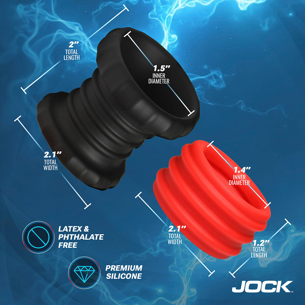 Silicone cock ring and ball stretcher set in red and black with dimensions.