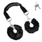 Black furry handcuffs with a handle and two keys.