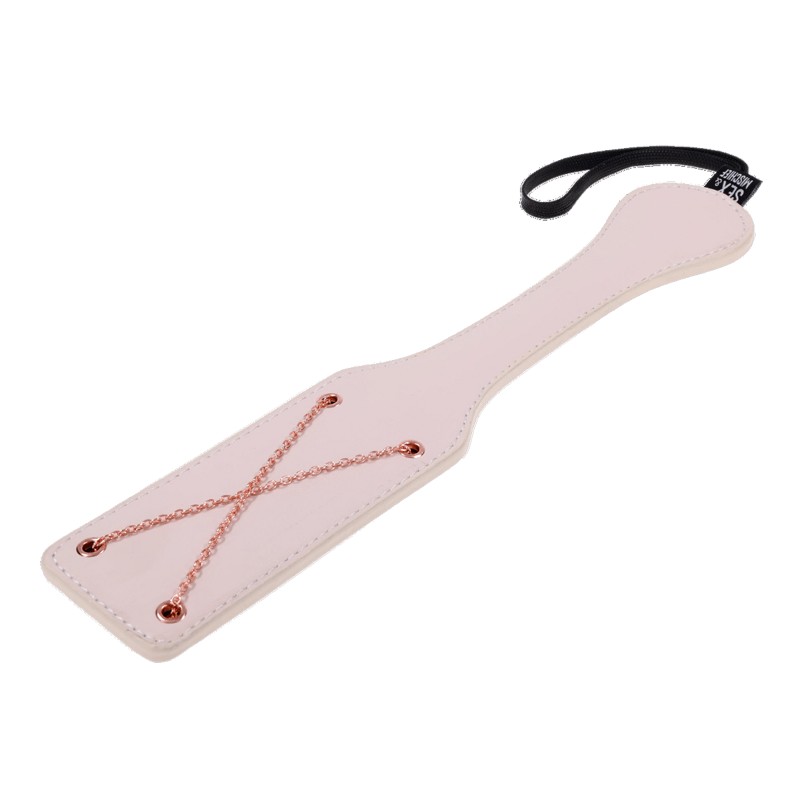 Faux leather paddle with rose gold chains and wrist loop.