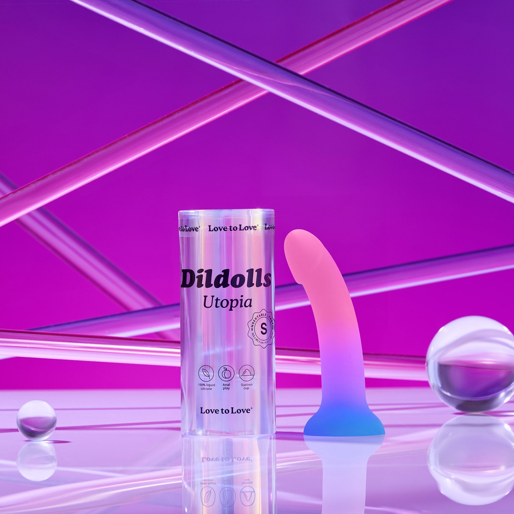 Utopia S curved liquid silicone dildo with suction base in pink and blue gradient.
