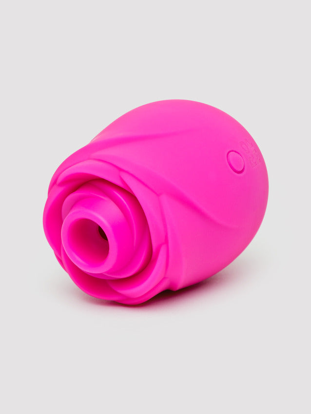 A bright pink silicone clitoral stimulator shaped like a rose.