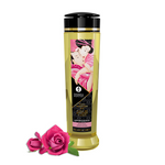 Shunga Aphrodisia massage oil with rose petals and a Japanese art label.