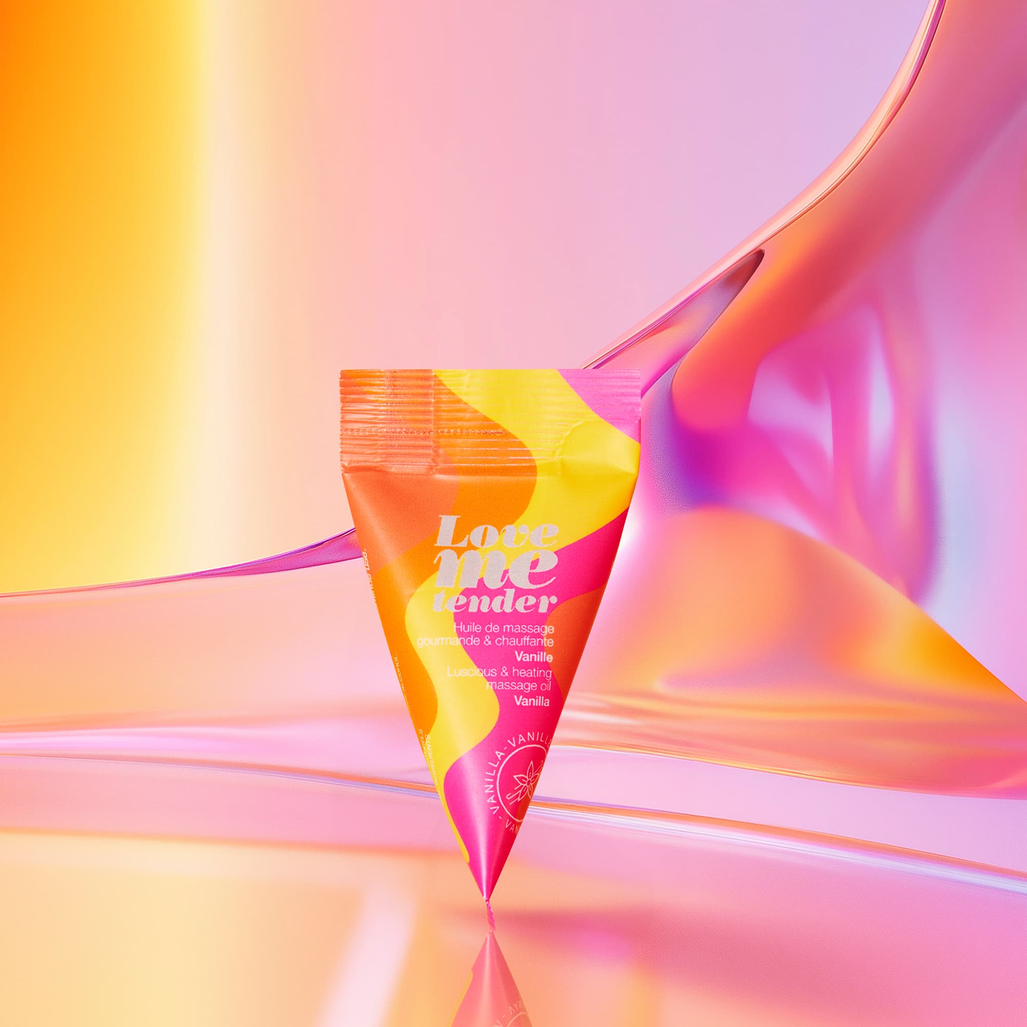 A tube of "Love me tender" vanilla massage oil with a colorful design.