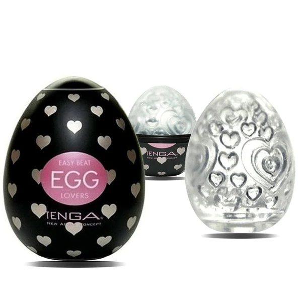 Three egg-shaped Tenga pleasure sleeves with heart patterns.