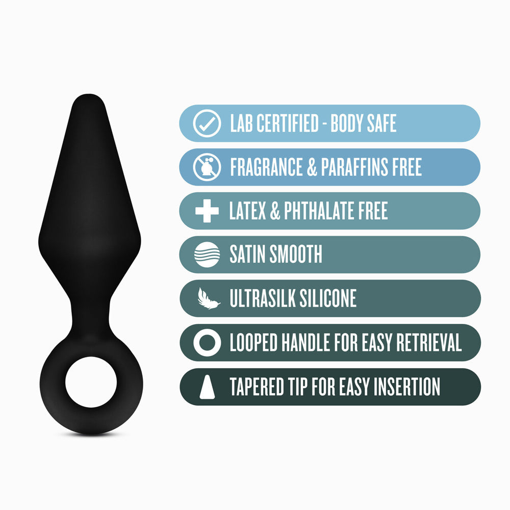 Black silicone anal plug with a looped base and text features.