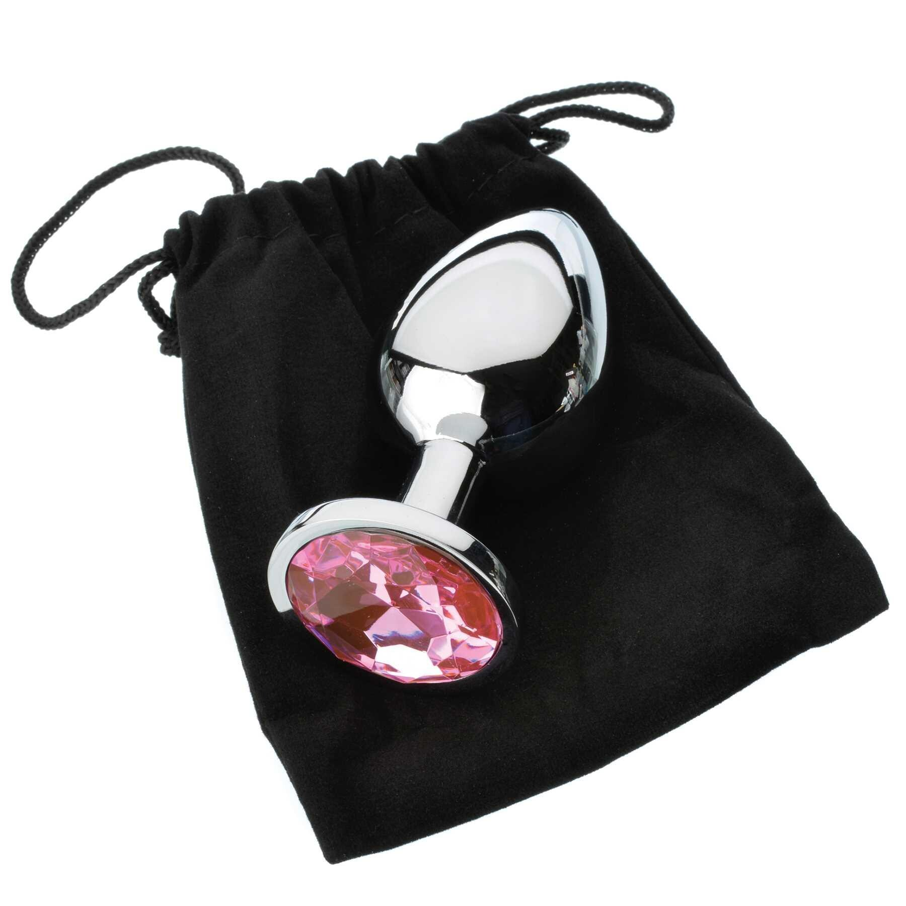 Pink gem anal plug with a silver stem and a black drawstring bag.