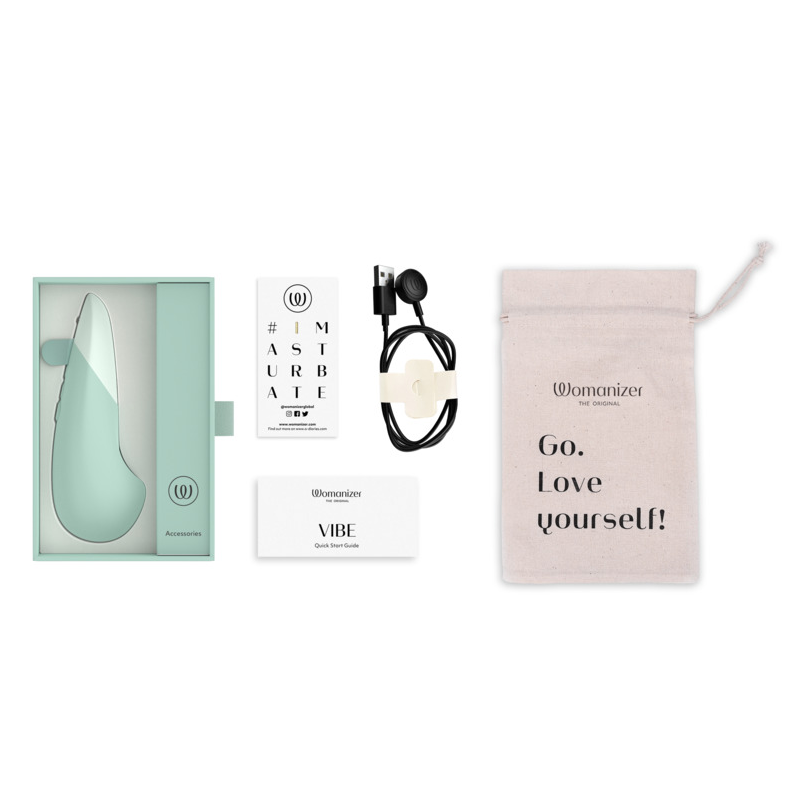Womanizer Vibe clitoral vibrator with charging cable and storage bag.