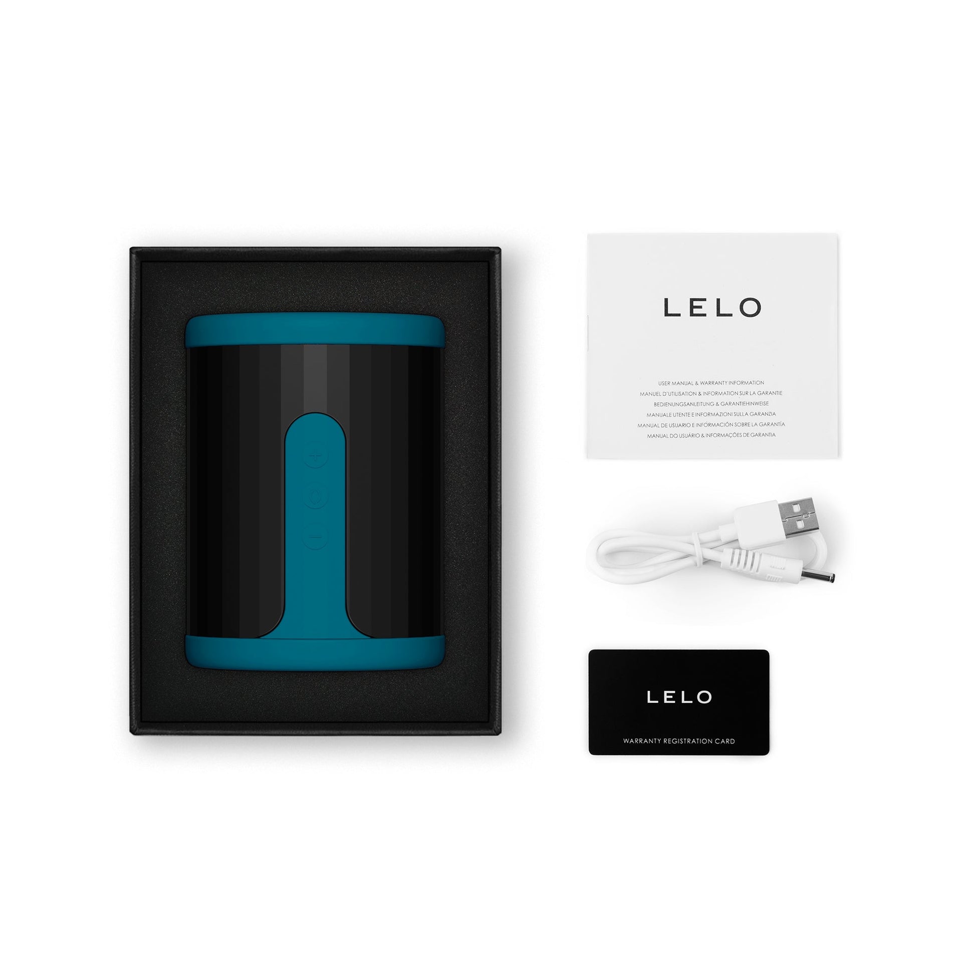 Teal Lelo F2S app-controlled stroker with charging cable and warranty card.