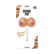 Caramel flavored novelty lollipop shaped like breasts.
