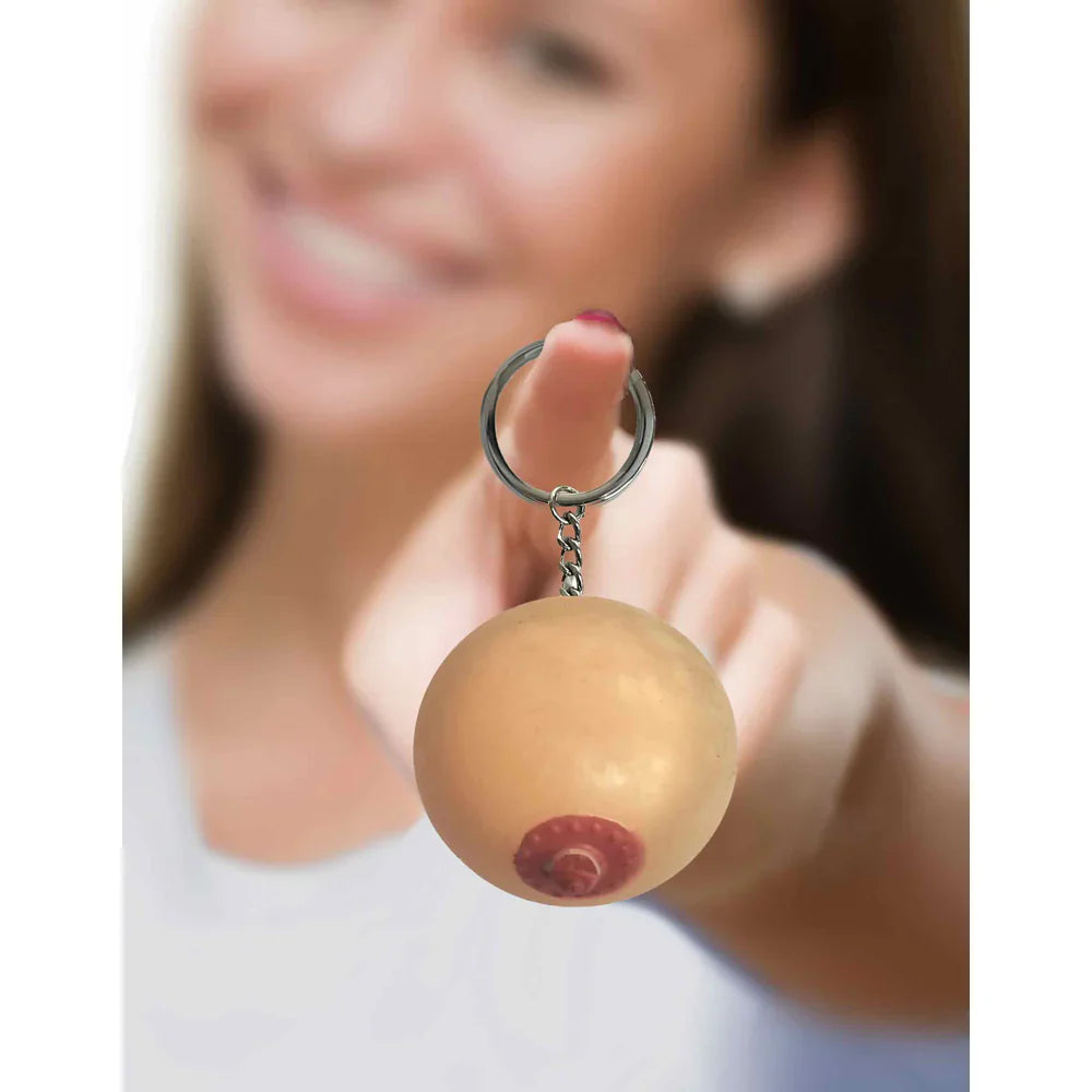 Silicone boob-shaped novelty keychain stress toy.