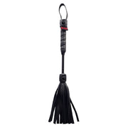 Black leather mini flogger with a loop handle and fringe.