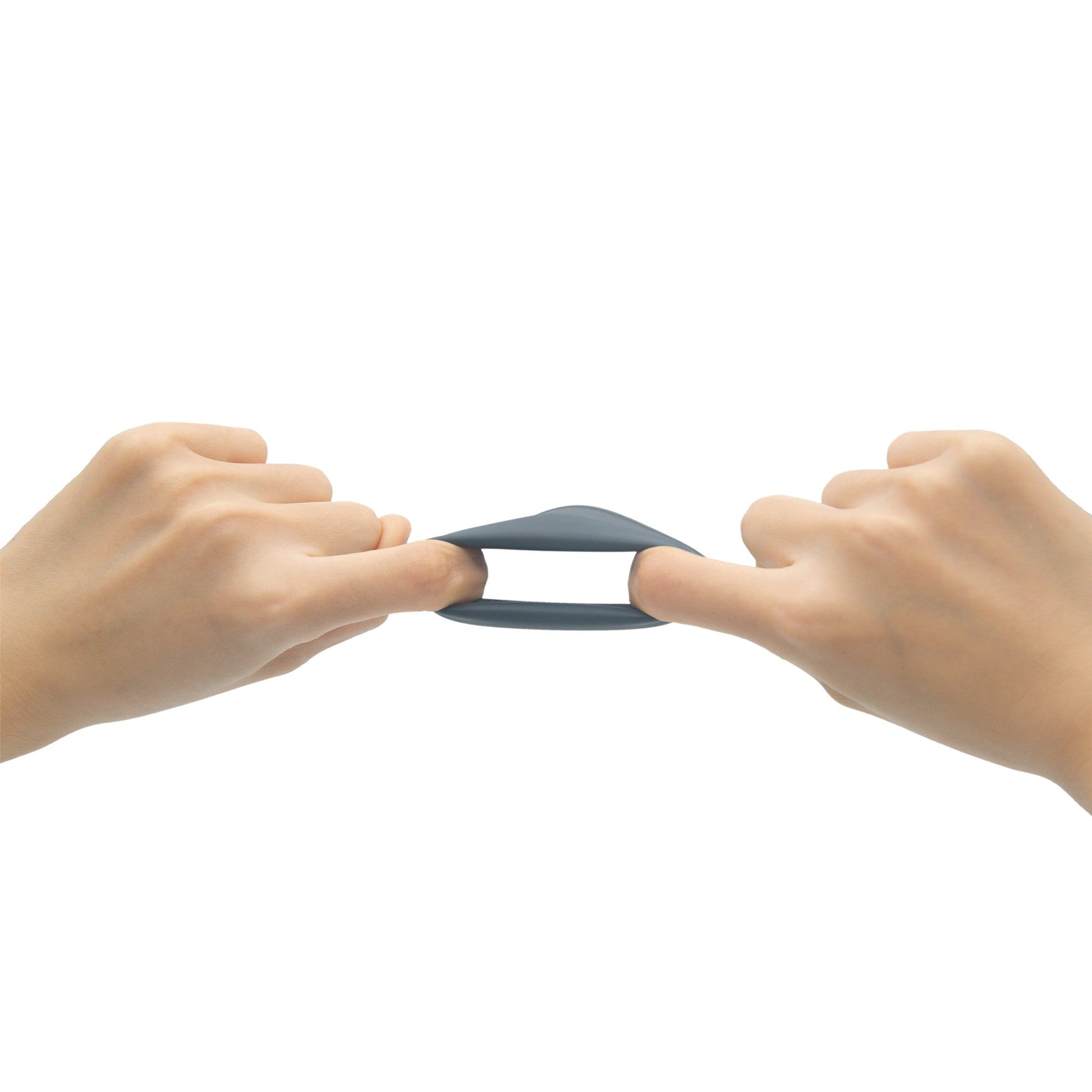 Two hands stretch a grey flexible material.