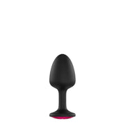 Black anal plug with a pink gem accent.