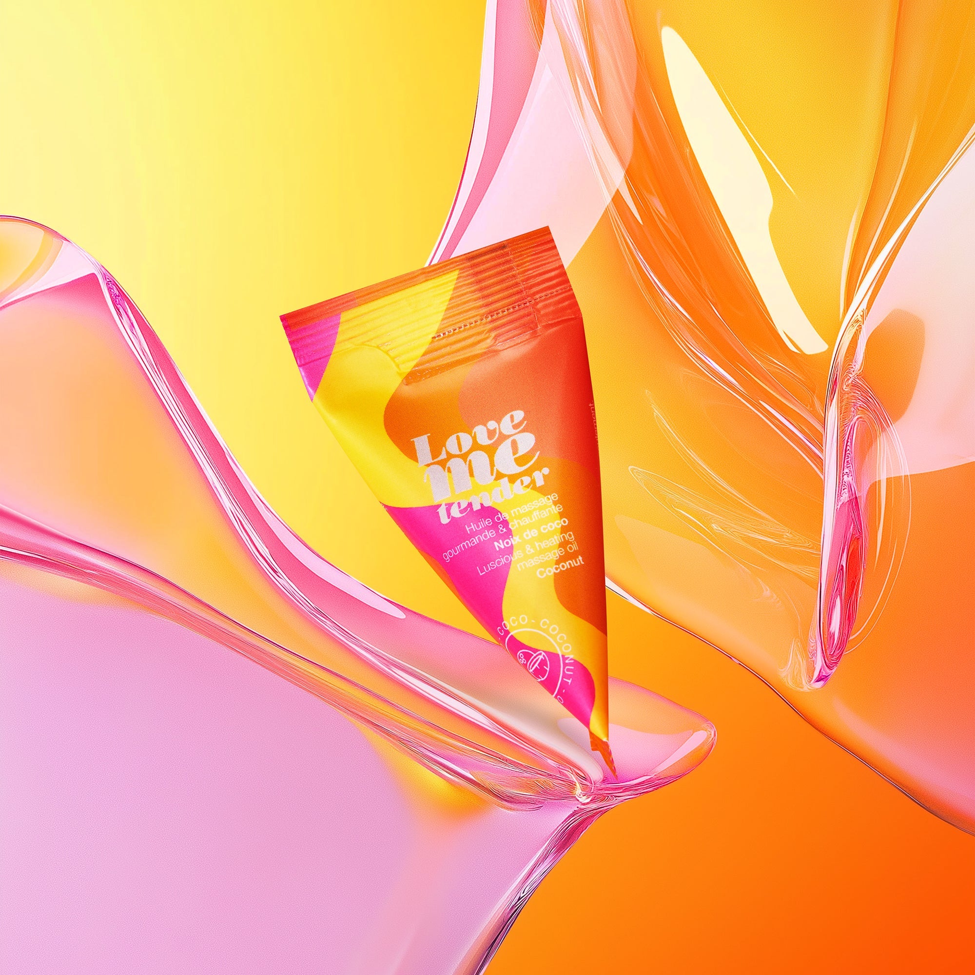 Tube of Love me tender coconut warming massage oil with abstract pink and orange swirls.