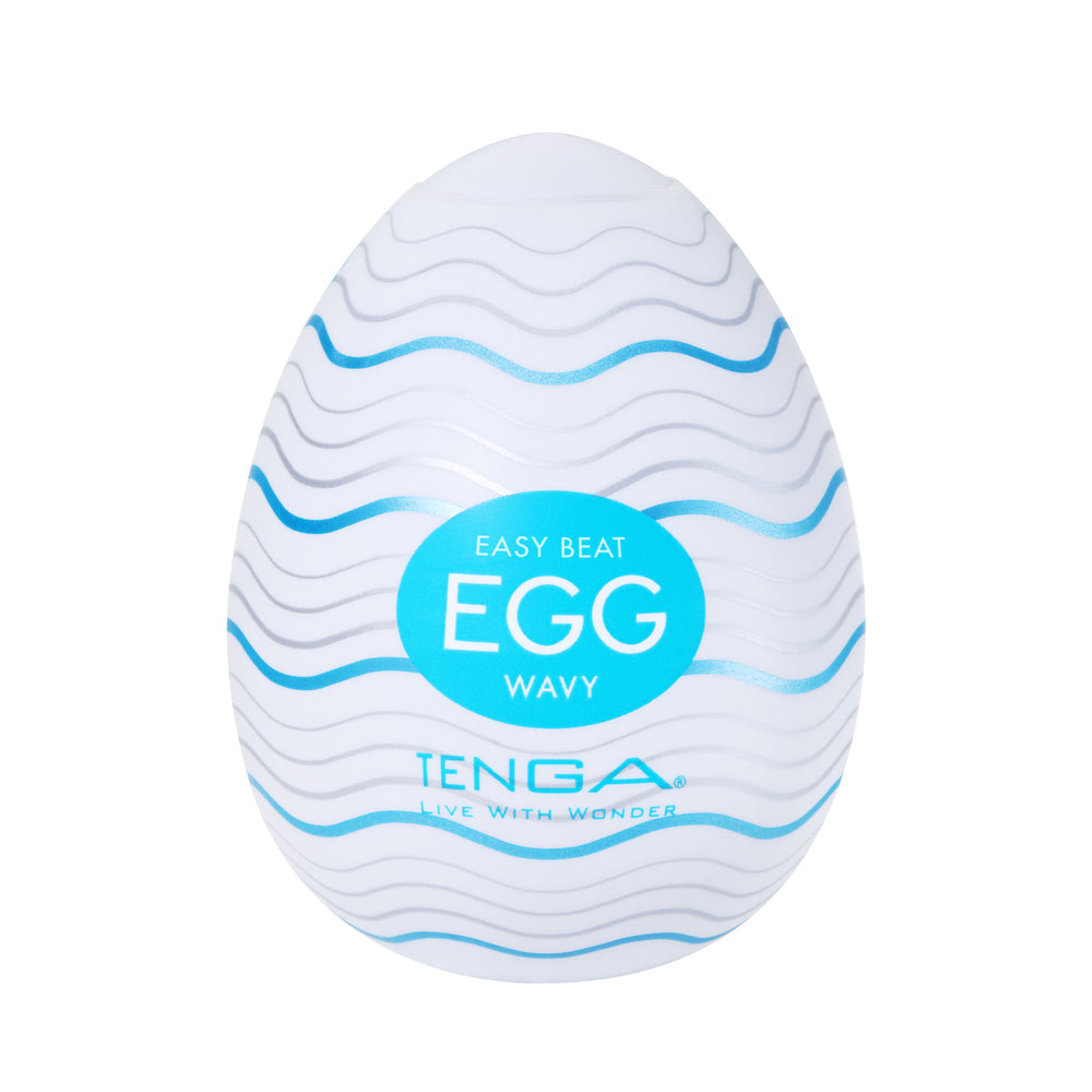A white Tenga egg-shaped masturbator with blue and silver wavy lines and text.