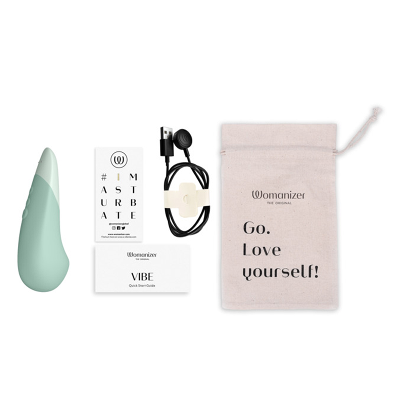 Womanizer Vibe clitoral vibrator with charging cable and storage bag.