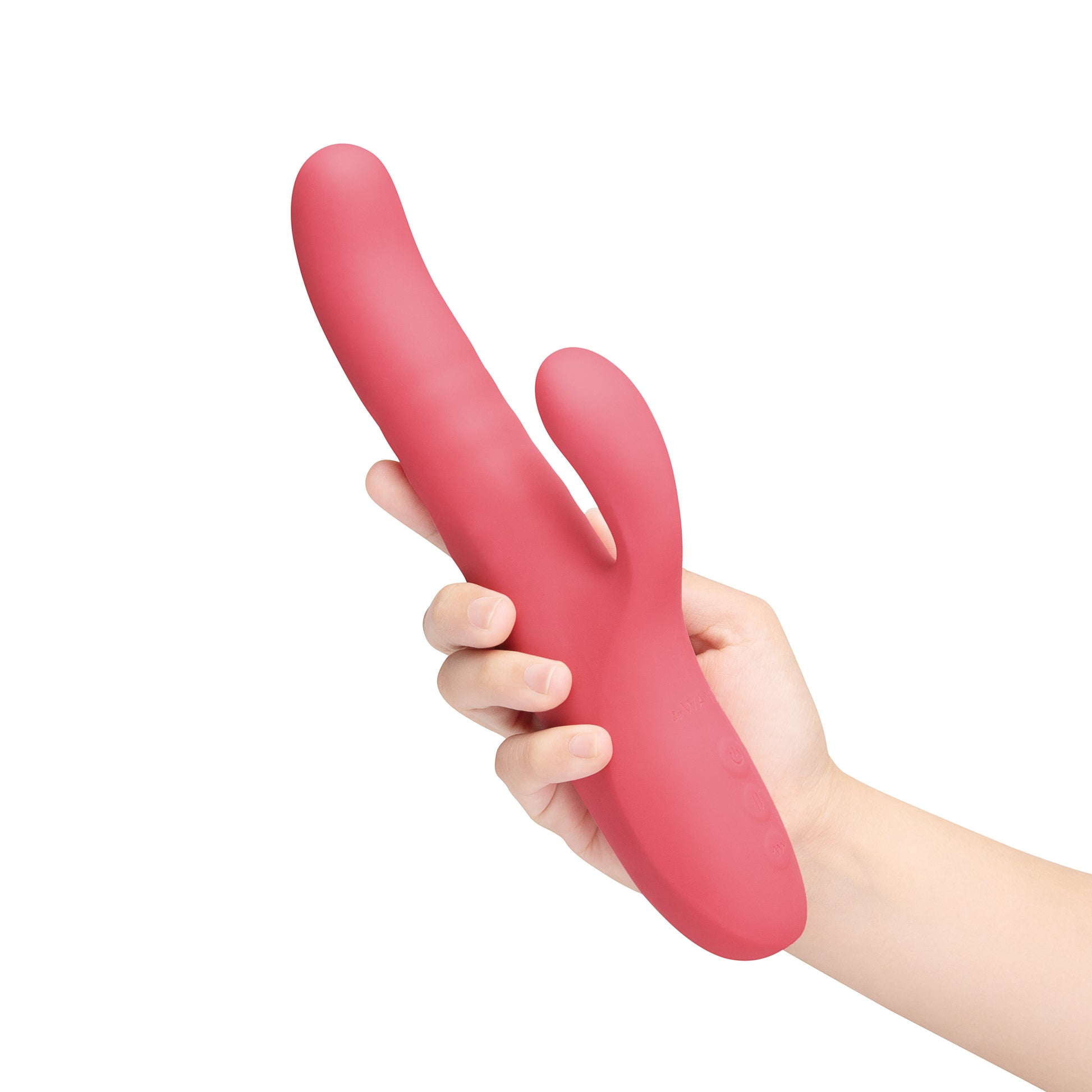 A pink rabbit vibrator held in a hand.