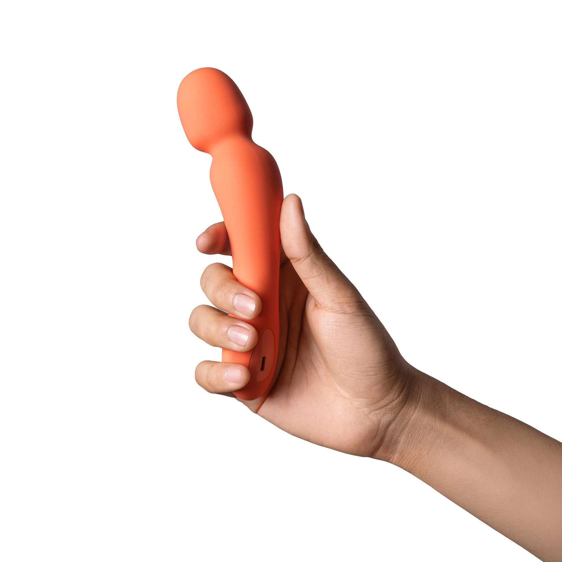 Orange silicone mini wand vibrator held in a hand.