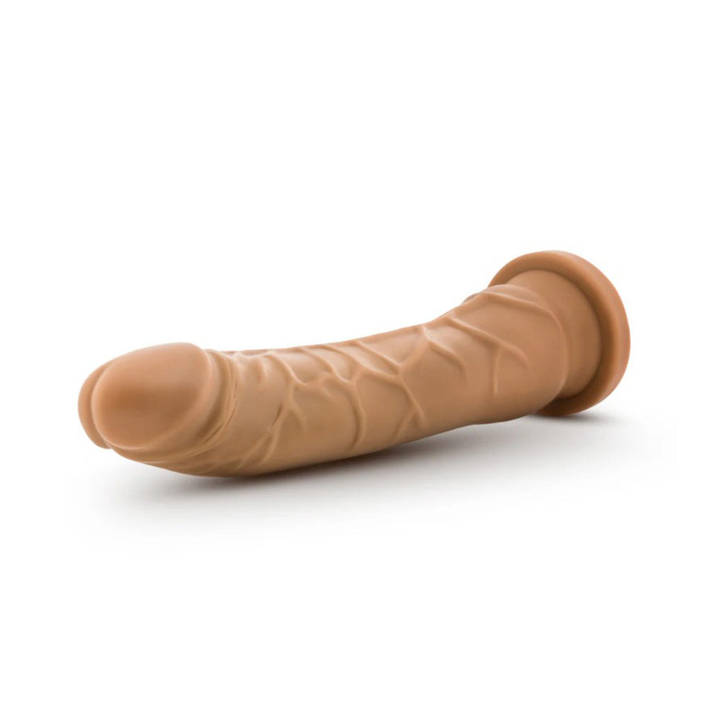 A 9.25-inch realistic dual-density dildo in tan with a suction cup base.