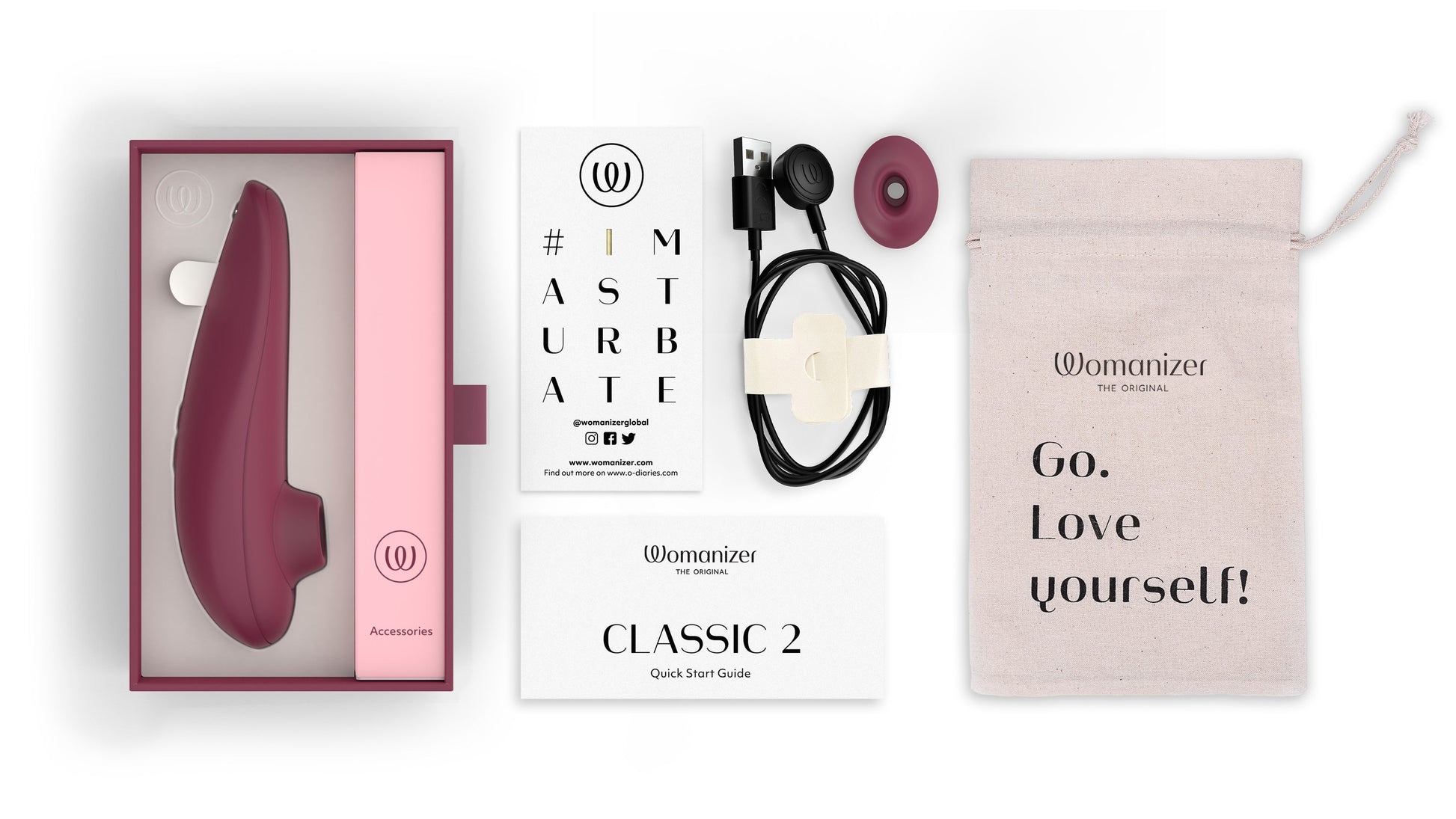 Womanizer Classic 2 clitoral stimulator in bordeaux with accessories.