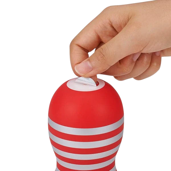 Red and silver striped male masturbator with a hand peeling off the top seal.
