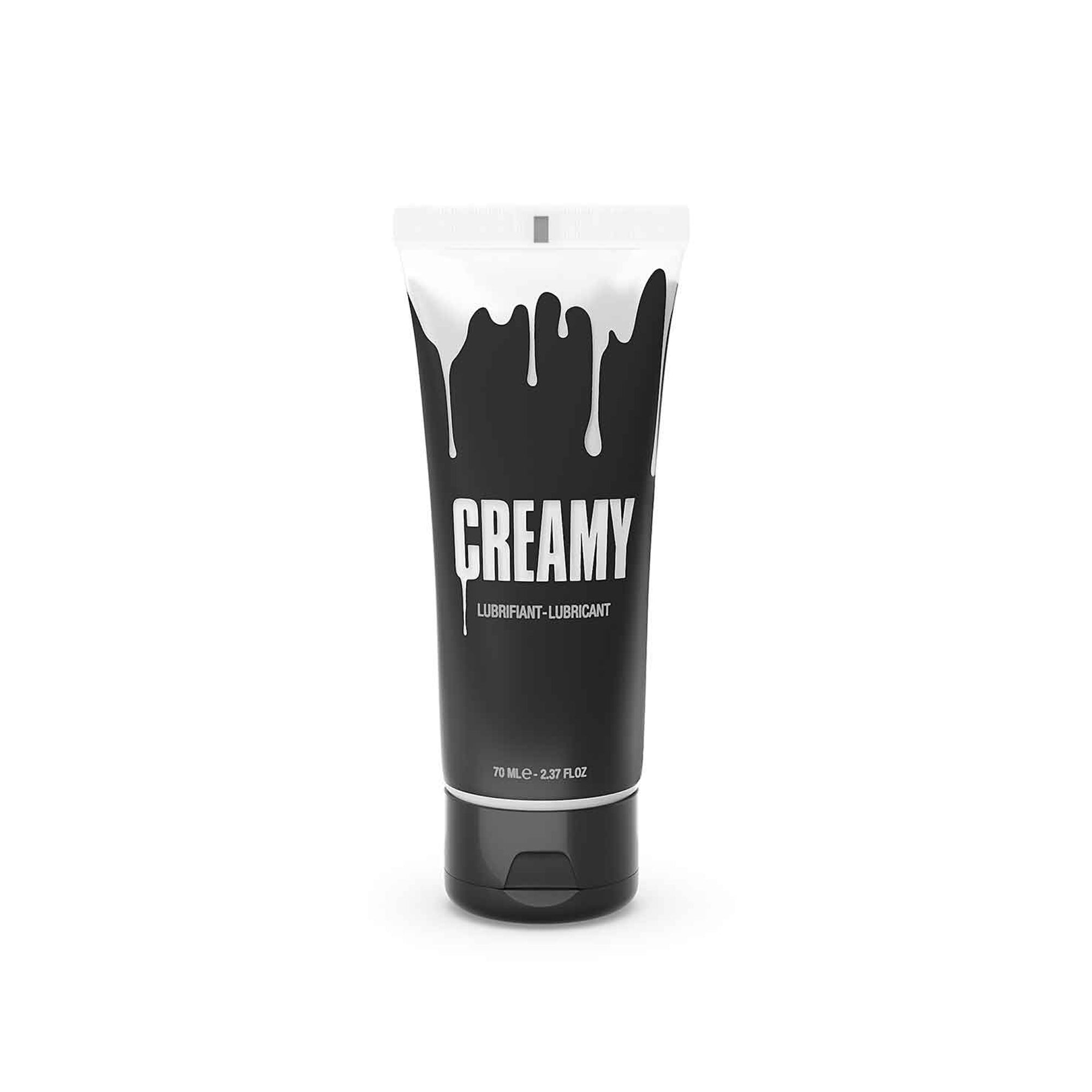 A black tube of Creamy lubricant with white dripping paint design.