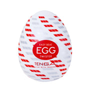 Tenga Twister Spiral egg-shaped male masturbator with red and gray pattern.