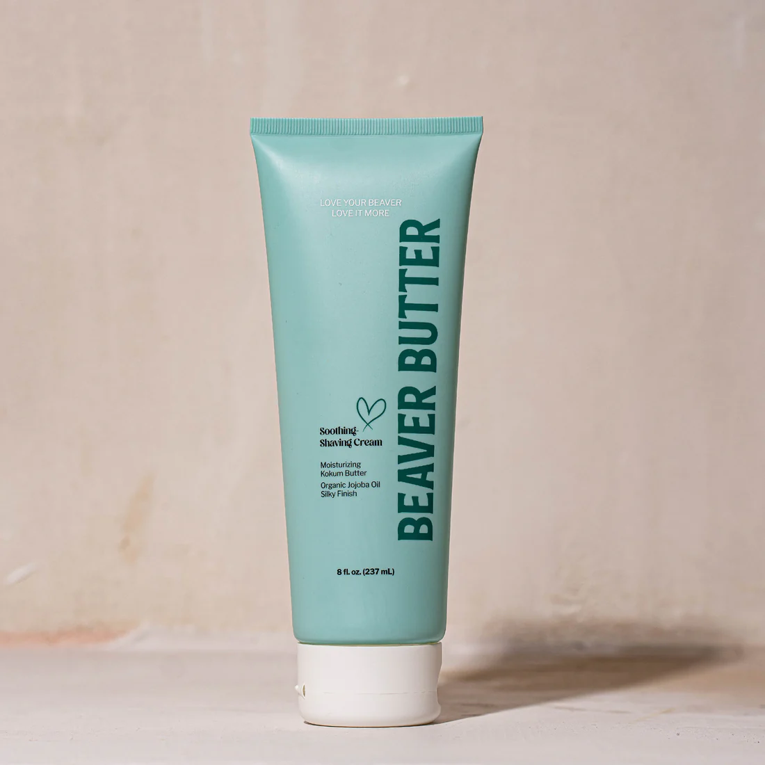 A teal tube of Beaver Butter Soothing Shaving Cream with white cap.