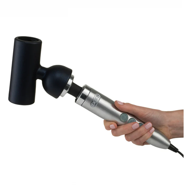 A hand holds a Doxy wand massager with a black textured sleeve attachment.