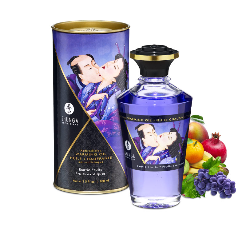 Shunga Exotic Fruits warming massage oil in a bottle with fruit and a tube.