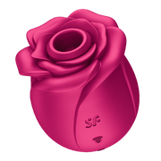 Pink rose-shaped clitoral air pulse vibrator with textured markings.