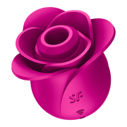 A pink rose-shaped clitoral vibrator with textured petals and a central opening.