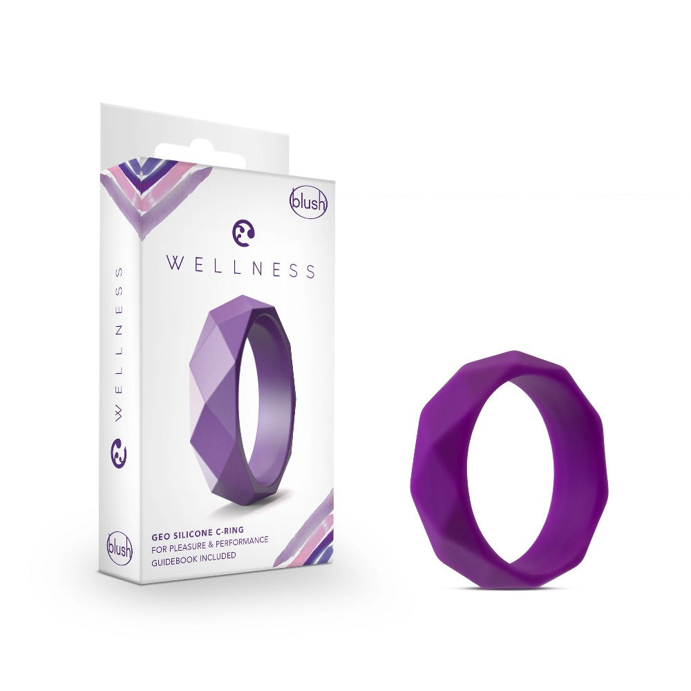 A purple geometric silicone cock ring next to its packaging.