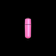 Pink bullet vibrator with a black top and a black band.