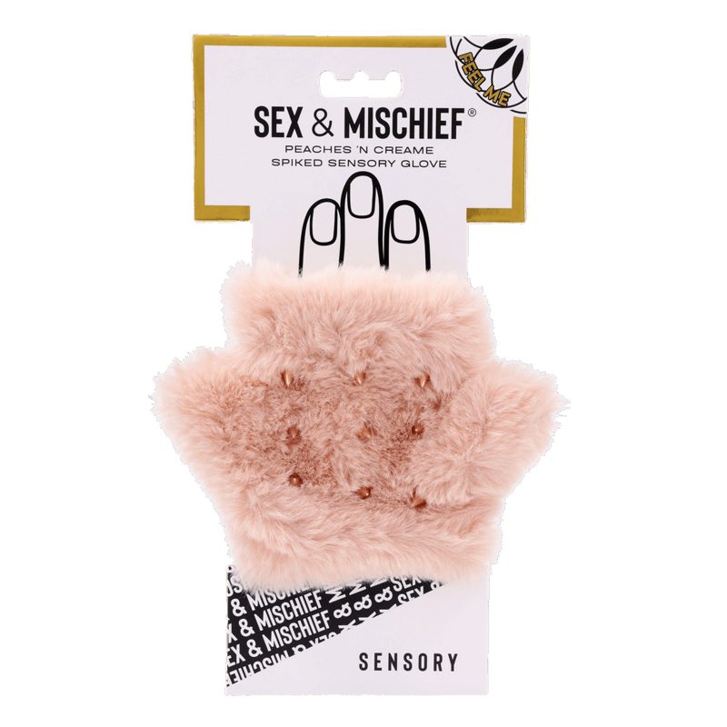 A pink faux fur glove with rose gold spikes and a white card backing.