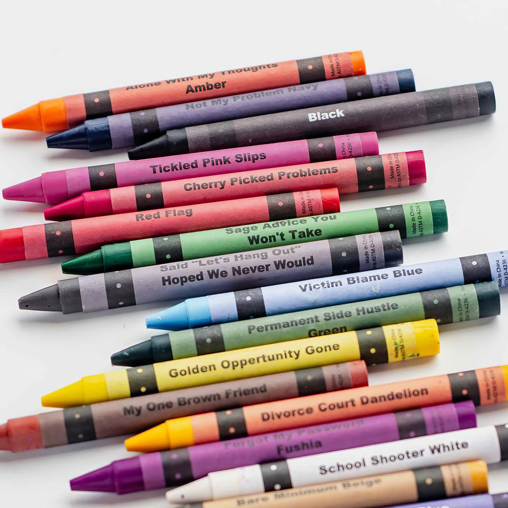 A set of adult coloring crayons with humorous names like "Amber" and "Black".