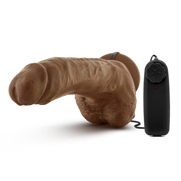 9-inch tan realistic vibrating dildo with suction cup base and black remote control.