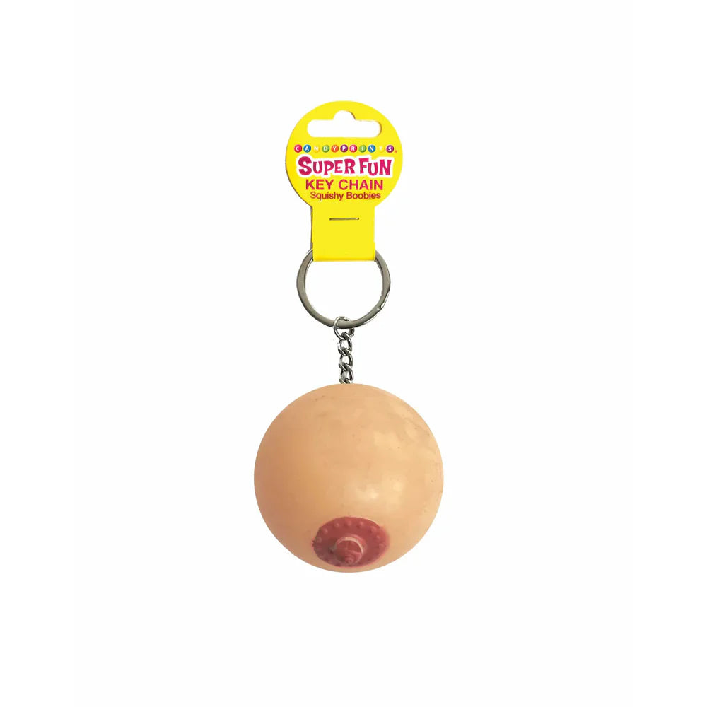 A novelty keychain shaped like a squishy boob with a pink nipple.