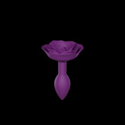 Purple silicone anal plug shaped like an open rose with a tapered base.