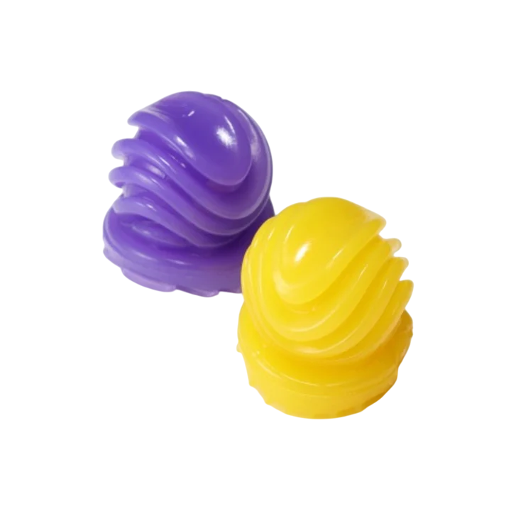 Two textured, colorful stroker balls, one purple and one yellow.