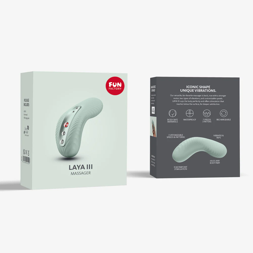 Laya III massager in mint green with product details on packaging.