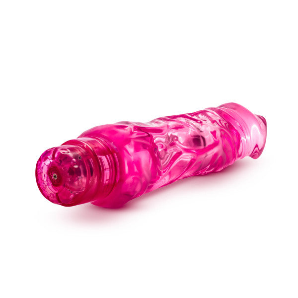 A pink, textured, waterproof vibrator with a clear tip.