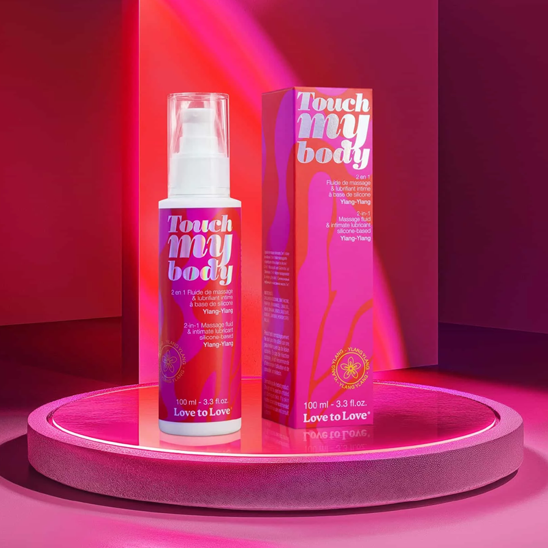 A bottle and box of Ylang-Ylang 2-in-1 massage fluid and lubricant.